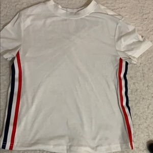 white shirt with red and blue striped on side